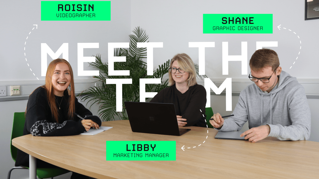 A group photo of our team sat at a table